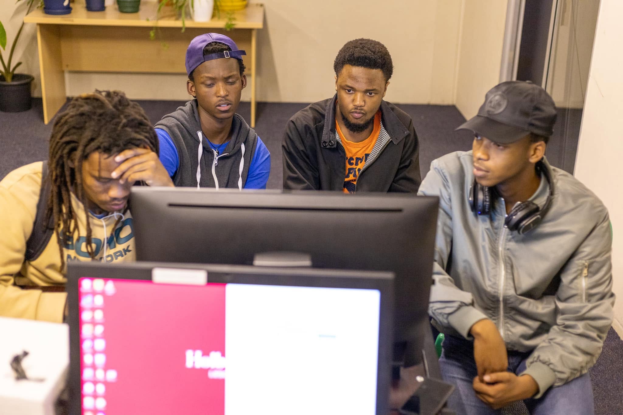 Holberton Lesotho students collaborating and reviewing code